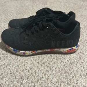 NOBULL black daisy trainers